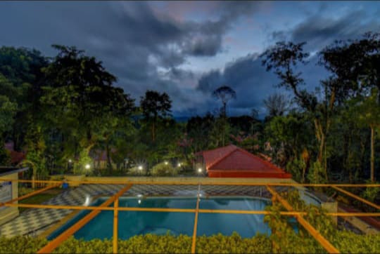 Illuminated pool glow at twilight, creating a magical atmosphere
